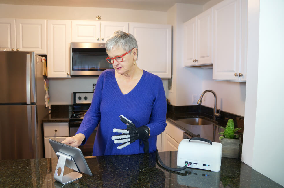 Woman with Imago Rehab's wearable robotics and digital health technology